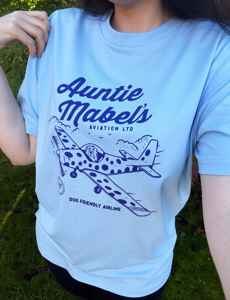 Model wearing our 90s TV show Come Outside inspired T-shirt design - featuring Pippin in a polka dot plane