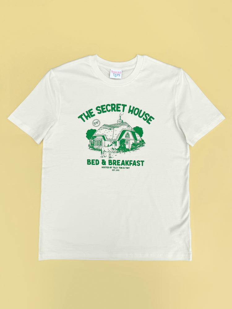 Full length shot of 90s TV show Tots TV inspired T-shirt design featuring a hideawy cottage and donkey!