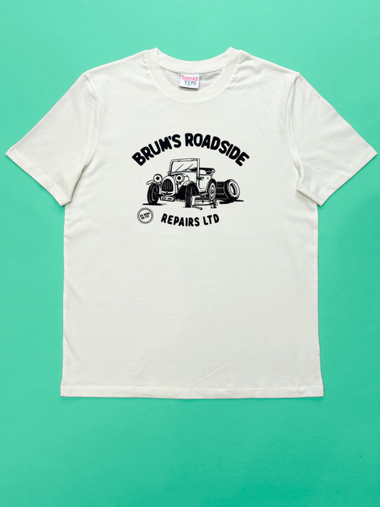 A full shot of our 90s TV Show Brum inspired T-shirt design featuring a car with eyes in a car workshop